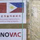 A worker unloads a box of Sinovac Biotech's CoronaVac vaccines against the coronavirus disease (COVID-19) from a Chinese military aircraft at Villamor Air Base in Pasay, Metro Manila, Philippines,